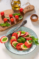 Fresh Italian Caprese Salad on Wooden Background