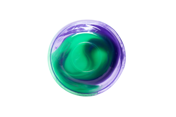 a green and purple liquid in a glass