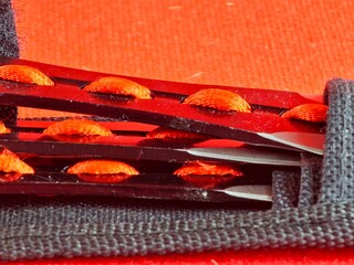 Close-up of throwing knife handles in case for combat training and sport throwing