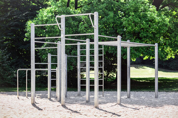 Workout Gym Pull-Up Bars Trainer Equipment Outdoor. Modern Workout Gym Outdoors. Free Standing Pull-Up Bars on Nature Background.
