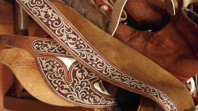 Decorative intricate embroidered leatherwork cowboy chaps 