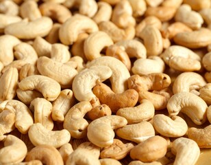 Fototapeta premium Close-up of cashews, showcasing their unique shape and inviting color ideal for themes of healthy snacks, vegan recipes, or wholesome ingredients. A collection of cashews, ready to be enjoyed 