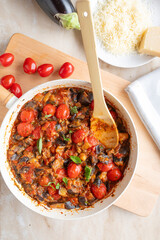 Eggplant, tomato ratatouille in a skillet fresh and homemade cooked. Healthy summer food