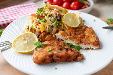 Chicken Schnitzel with delicious pasta salad made with spaghetti noodles and feta, greek style fresh and homemade cooked