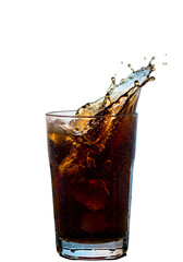 Abstract Photo Of Cola Drink Splash In Glass With Ice Cubes Against Black
