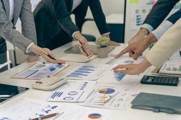 Business people discussing using financial document data charts and graphs. Business meeting. Financial analysis to determine business growth strategy and success.