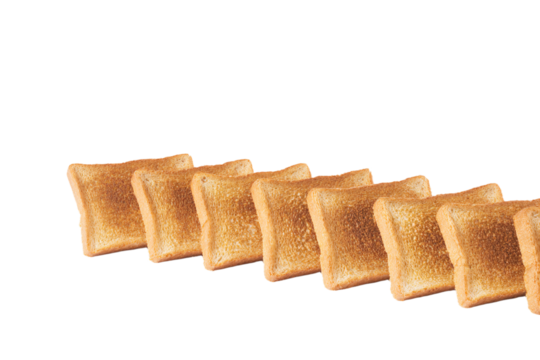 a row of toasted bread sitting on top of a white surface