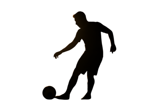 Football Player Silhouette in Action Against a Dark Background Photo
