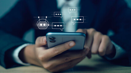 Hand holding smartphone with chatbot interface, artificial intelligence virtual assistant, AI chat support, digital communication technology for customer service and automation concept.