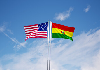flags of  bolivia and United States of America over blue sky background.