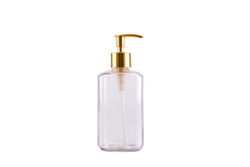 a clear bottle with a gold pump on a white background