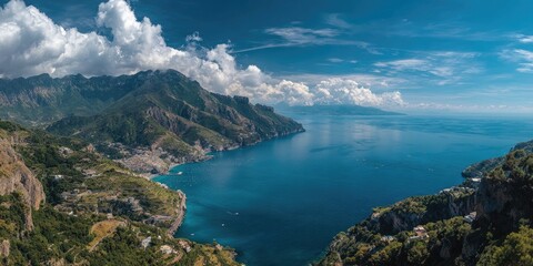 Obraz premium Panoramic view of the Amalfi Coast, Italy. Coastal mountains meet turquoise sea under a sunny sky