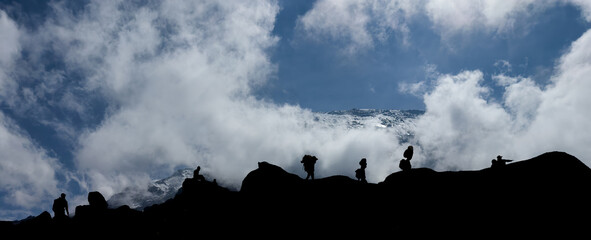 Mountaineers walking on mountain ridge in kilimanjaro.