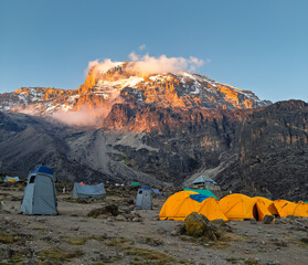 Campsite illuminated by  the sun on mount kilimanjaro.