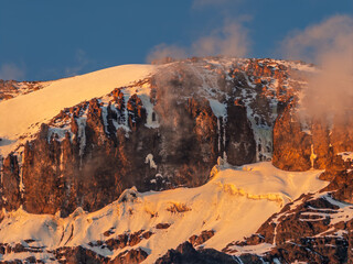Majestic kilimanjaro mountain glowing during sunset in tanzania, africa.