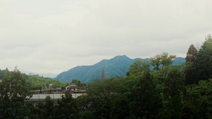 Drone view of a picturesque mountain valley. The highway in the foreground