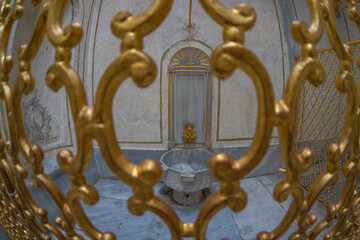 Golden gate protecting an ancient fountain in istanbul