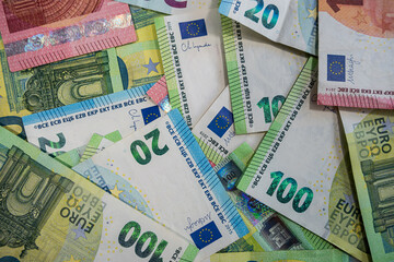 Mixed Euro banknotes background in various values representing cash flow, banking and savings