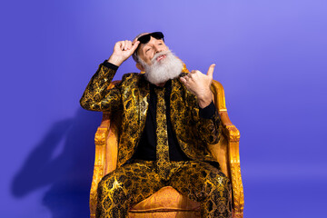 Charismatic gentleman showcasing luxury fashion with bold style and attitude in a vibrant setting