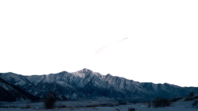 A brilliant meteor moving across a night sky above snowy mountains - Powered by Adobe