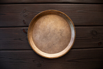 Plate on a dark wooden background, food background with copy space for text