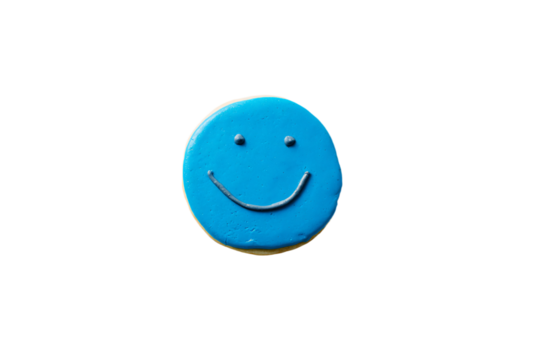 a blue cookie with a smiley face on it