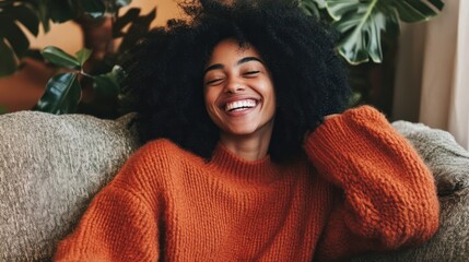 Woman laughing on a couch