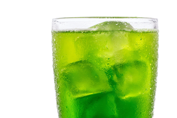 a glass of green liquid with ice cubes