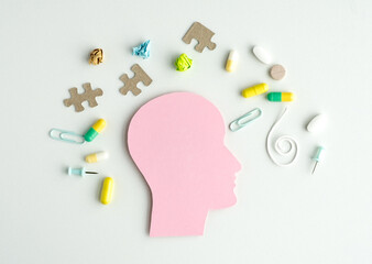 A pink head with a puzzle piece on it