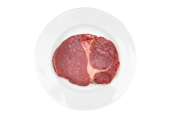 a piece of meat on a plate on a white surface