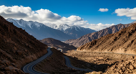 Scenic Mountain Landscape with Winding Road and Snowcapped Peaks, California