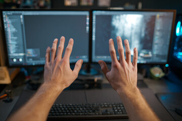 Hands Hover Over Dual Monitors. Developer codes, designs, works. Modern tech, technology, work, coding, development, programming, web use, marketing, technology concept.