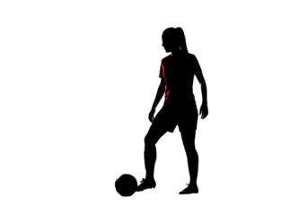 Silhouette Of A Football Player Kicking The Ball In The Dark Photo