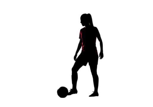Silhouette Of A Football Player Kicking The Ball In The Dark Photo