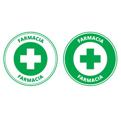 Fototapeta premium Green farmacia labels with the draw of a cross isolated on a white background (trad. pharmacy)