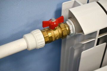 A water radiator for heating. A white radiator for indoor heating.