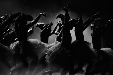 Ballet dancers  in dramatic stage lighting