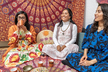 Women drinking organic cocoa during ceremony for alternative medicine and healthy living