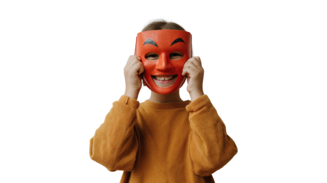 A child wearing a red smiling mask, enjoying a playful moment.
