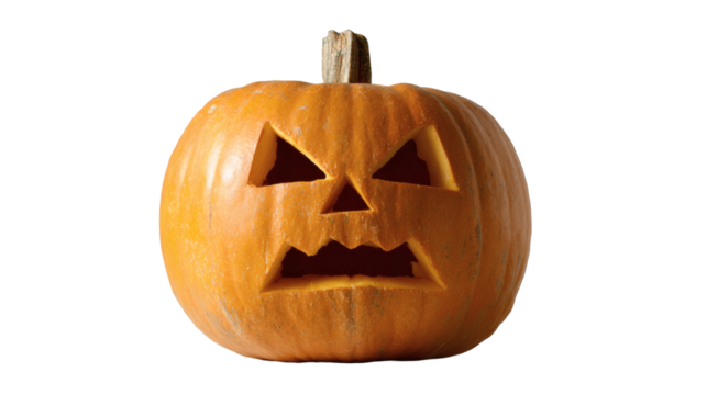 A carved pumpkin with an angry face is ready for halloween celebrations and festivities.