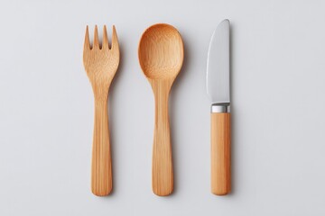set of eco-friendly minimalistic utensils made from bamboo and metal on plain white background