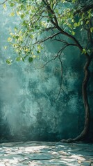 Tree with Leaves Against Teal Wall and Stone Floor with Sunlight