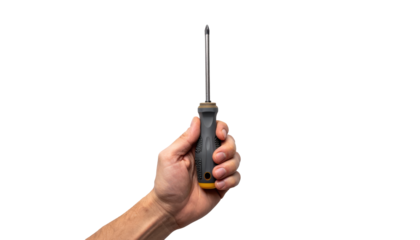 Closeup of a hand gently holding small, bright yellow object