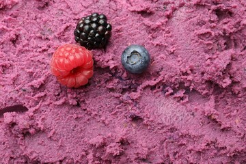 Delicious sorbet with berries as background, closeup