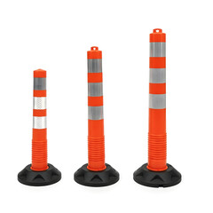 Traffic delineators with orange and white stripes on black bases  