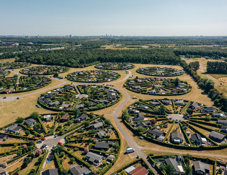 Aerial view of circular garden allotments radiating outwards like sunbeams, creating a unique urban oasis, Haveforeningen Harek&Atilde;&brvbar;r, Br&Atilde;&cedil;ndby, Denmark.
