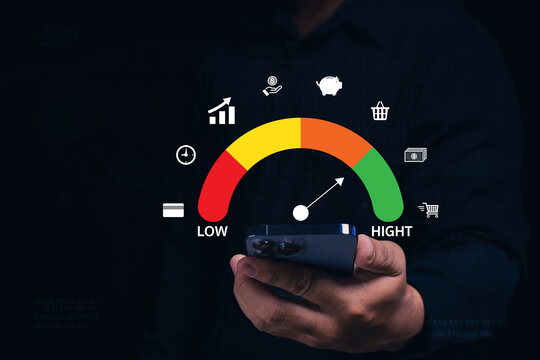 A person holds a smartphone with a colorful credit score gauge hovering above, showing indicators from low (red) to high (green).