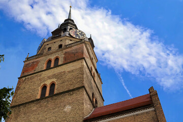 tower of cathedral against blue sky and white clouds