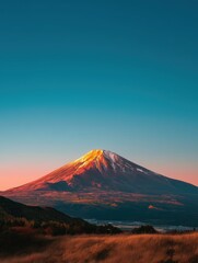 Mount Fuji silhouette with rising summer sun