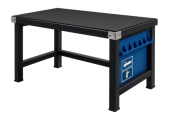 Workbench with a reinforced steel frame and rubberized top for a heavy machinery repair shop